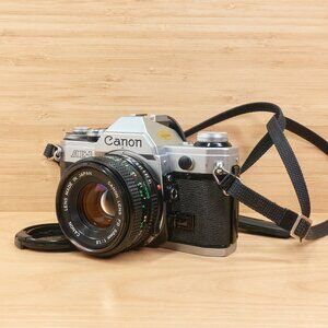 Legendary Canon AE-1 35mm film SLR paired with a bright Canon FD 50mm f/1.8 lens